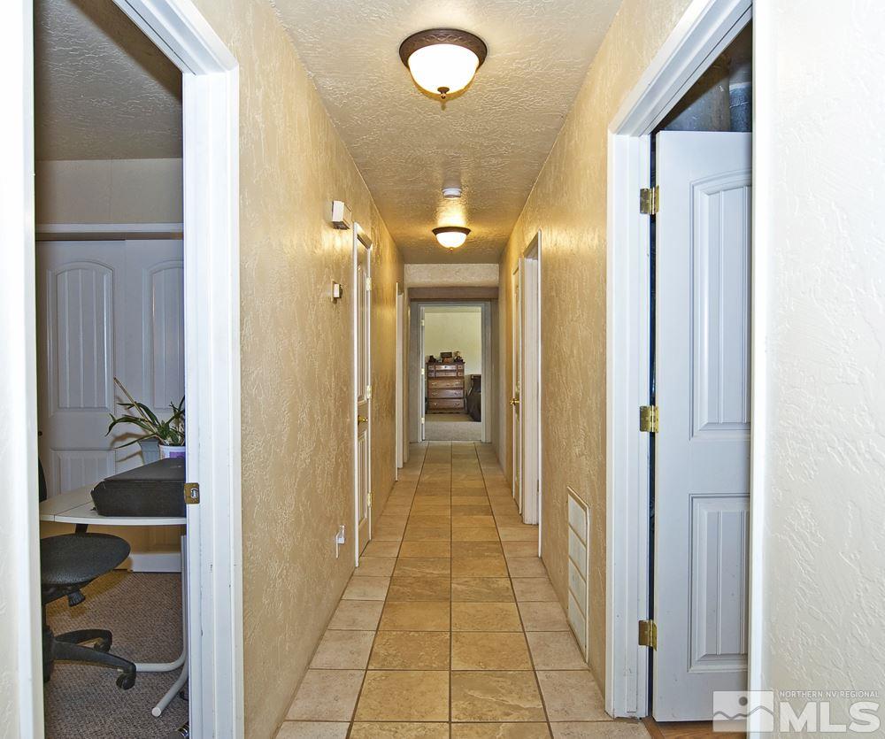 10810 Chesapeake Drive Reno, NV 89506 - Photo 13 of 22 a view of a hallway with wooden floor