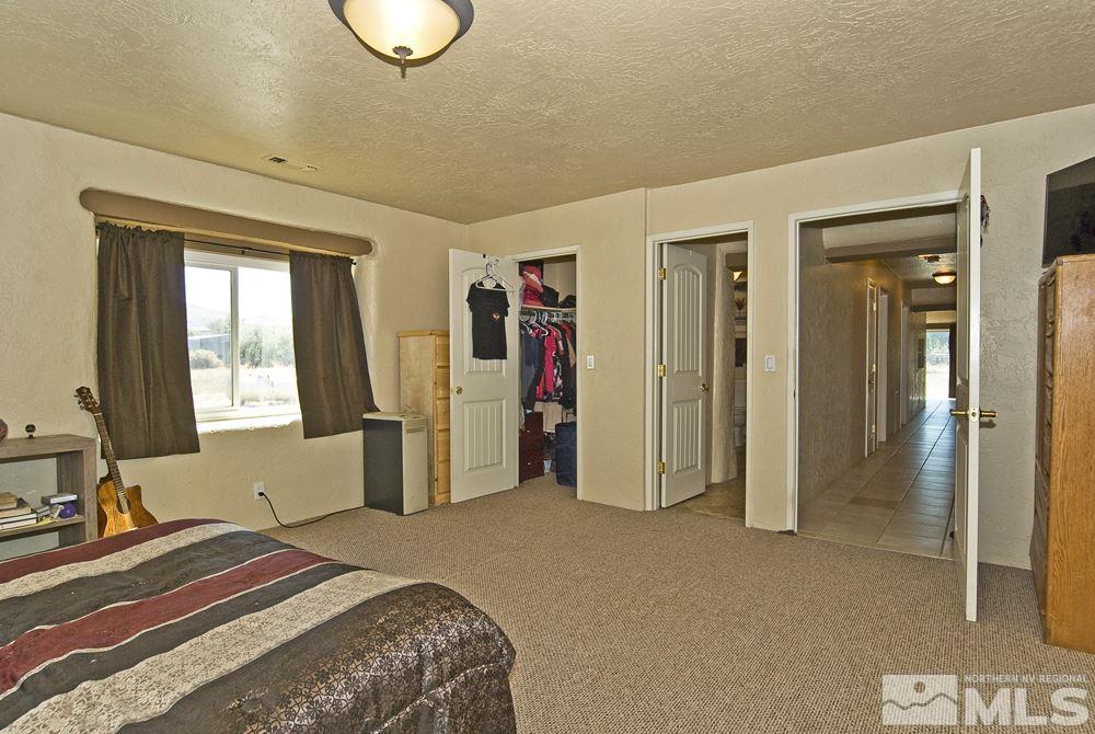10810 Chesapeake Drive Reno, NV 89506 - Photo 18 of 22 a bedroom with a bed and a window