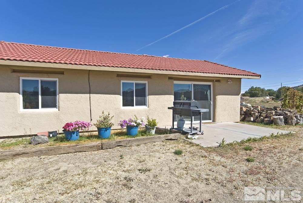 10810 Chesapeake Drive Reno, NV 89506 - Photo 4 of 22 a front view of a house with garden