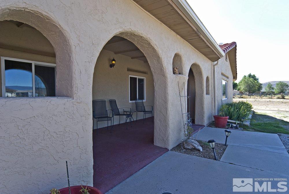 10810 Chesapeake Drive Reno, NV 89506 - Photo 7 of 22 a front view of a house with garden