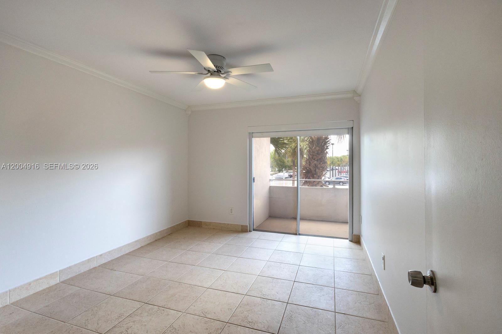 7747 Southwest 86th Street, Unit D205 Miami, FL 33143 - Photo 12 of 15 a view of an empty room and window