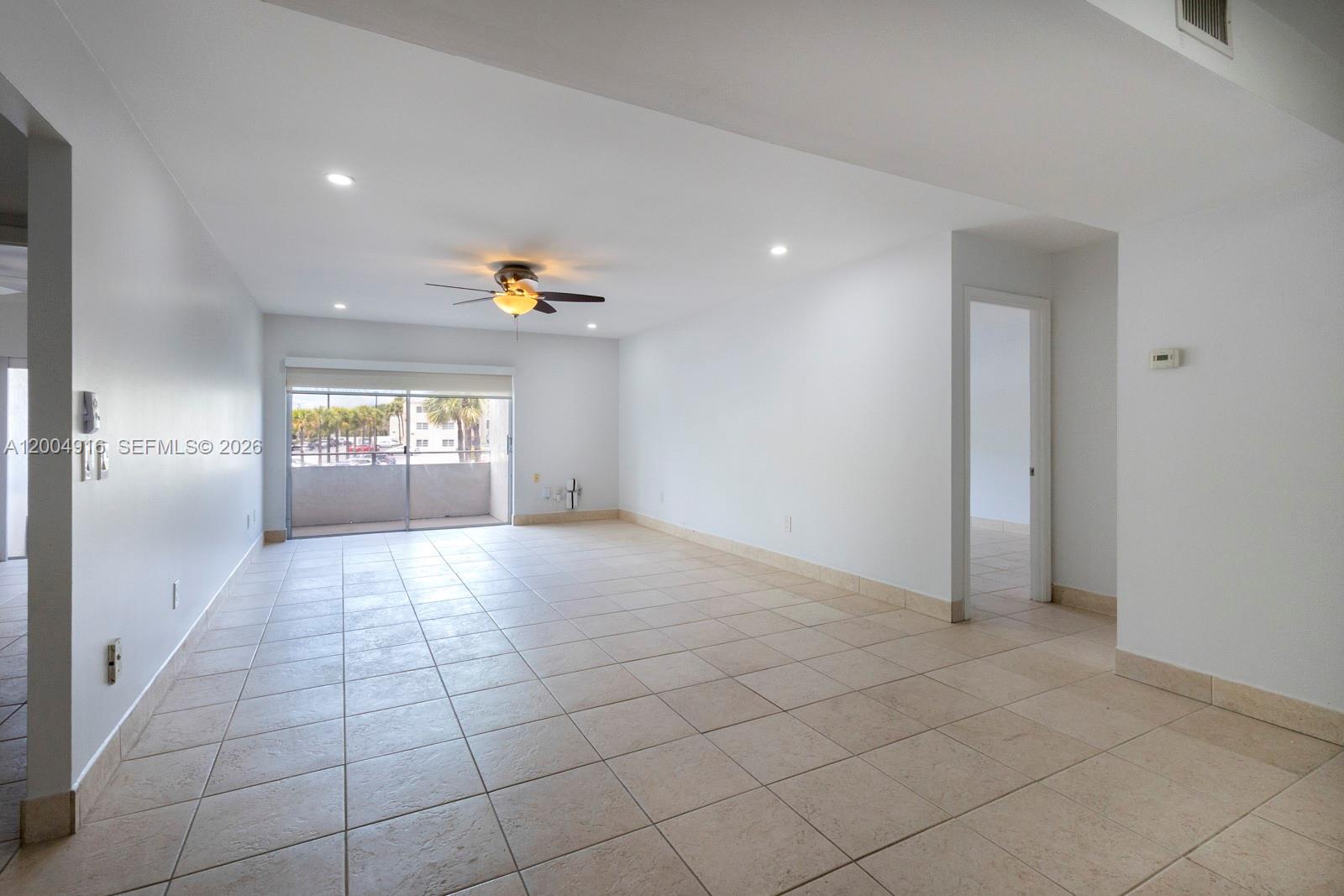 7747 Southwest 86th Street, Unit D205 Miami, FL 33143 - Photo 2 of 15 a view of an empty room and a window