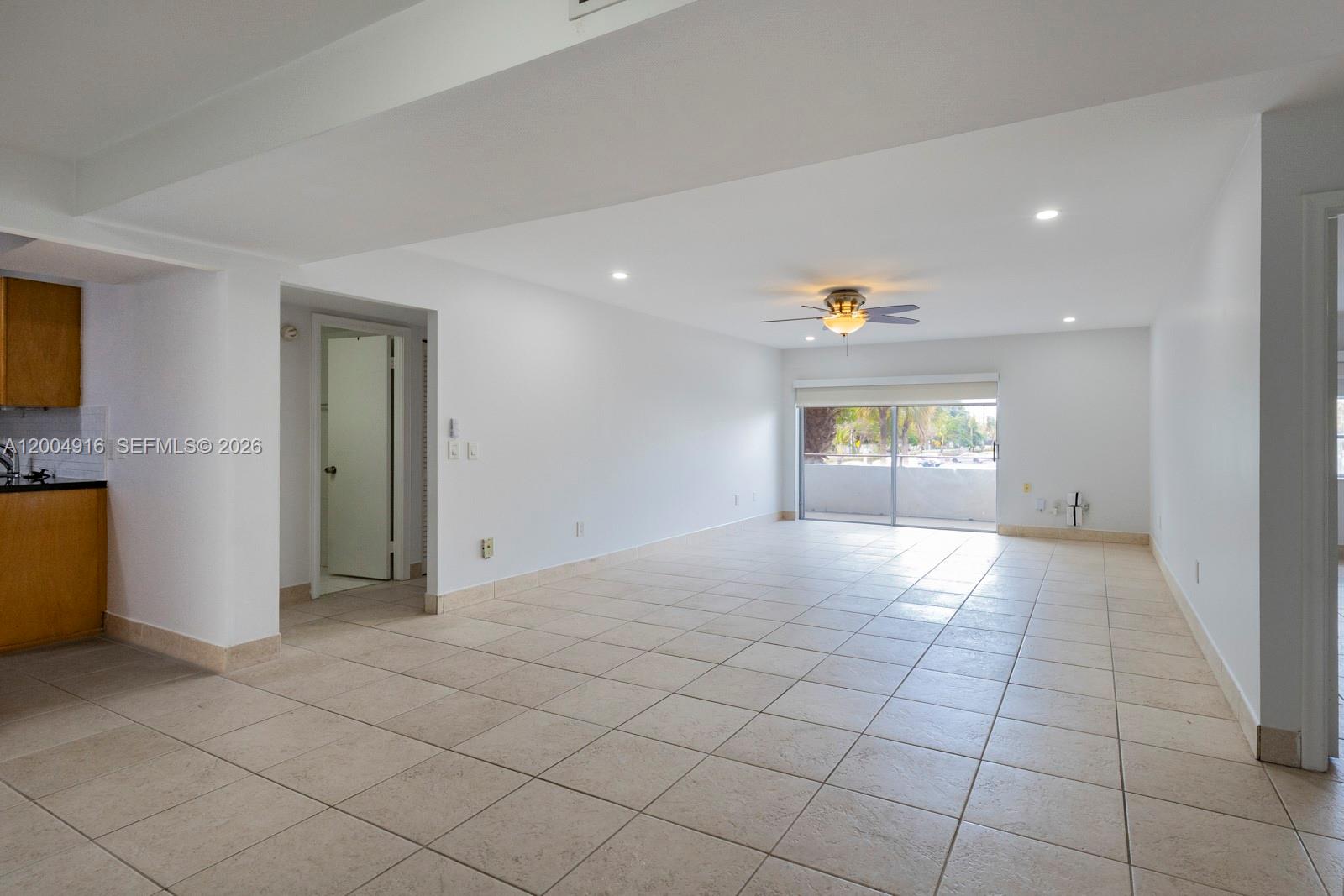 7747 Southwest 86th Street, Unit D205 Miami, FL 33143 - Photo 3 of 15 a view of an empty room and a window