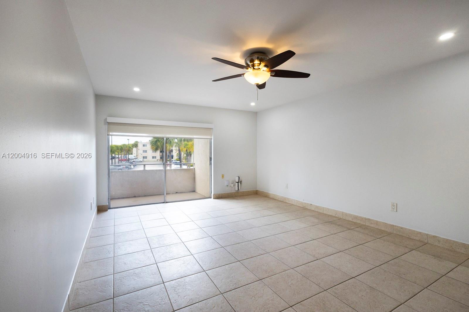 7747 Southwest 86th Street, Unit D205 Miami, FL 33143 - Photo 4 of 15 a view of an empty room and window