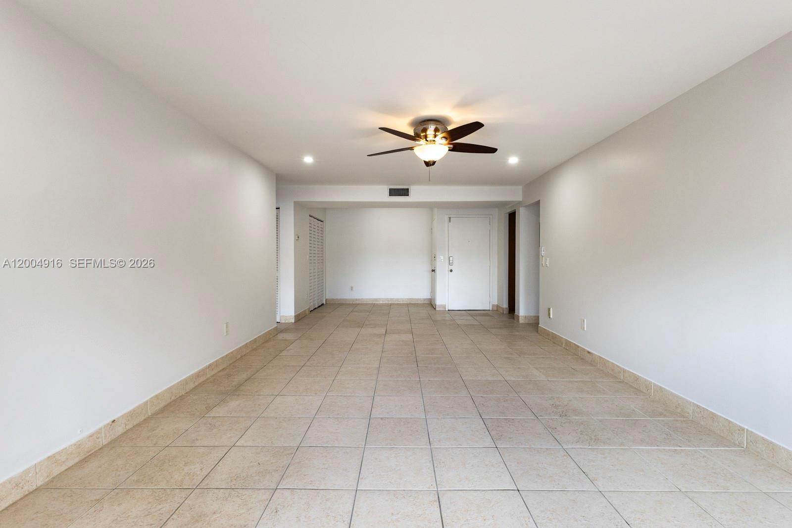 7747 Southwest 86th Street, Unit D205 Miami, FL 33143 - Photo 8 of 15 a view of an empty room with a window
