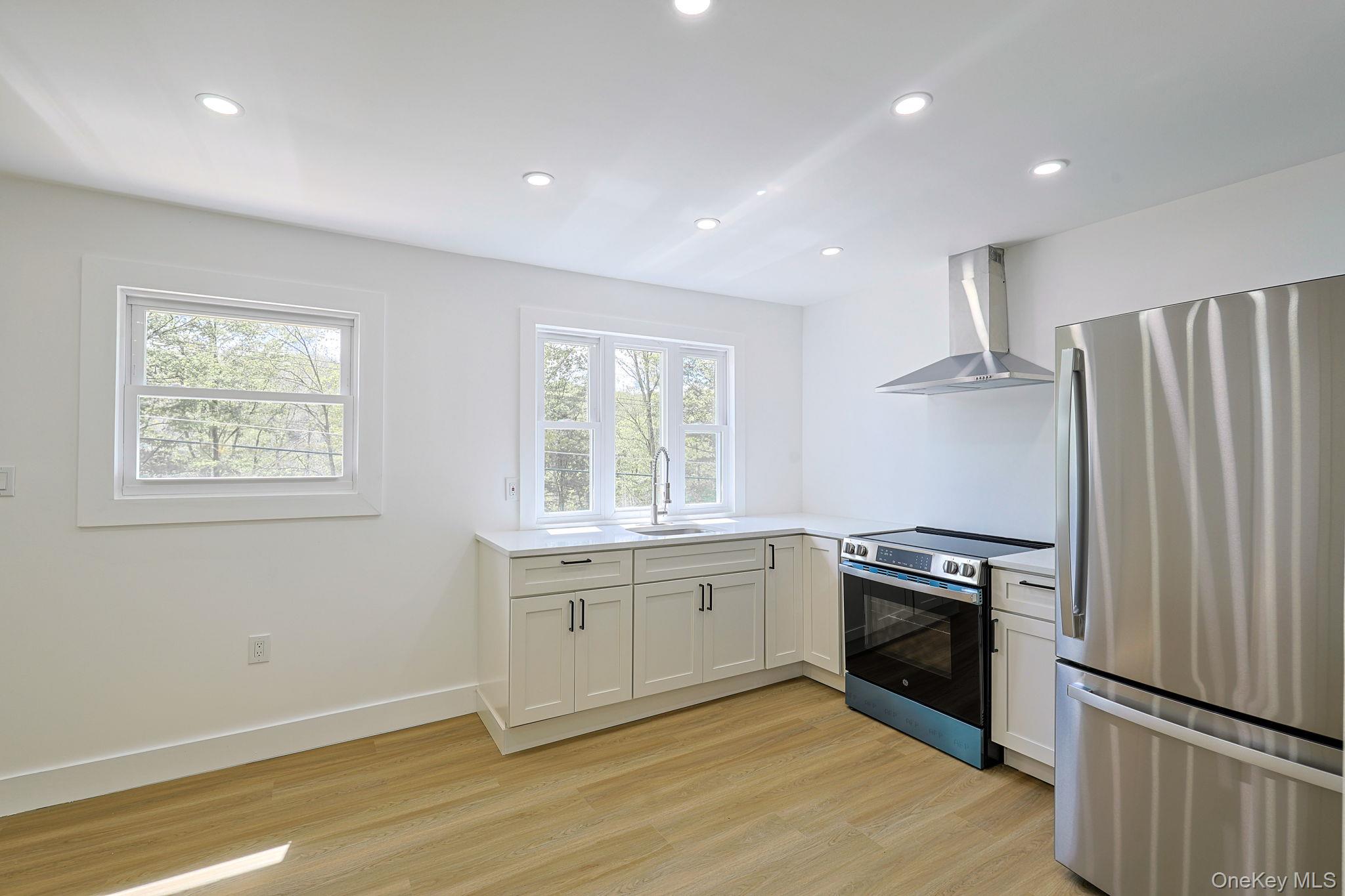 25 Overlook Road Woodbourne, NY 12788 - Photo 6 of 22 a kitchen with stainless steel appliances granite countertop a stove a sink and a refrigerator