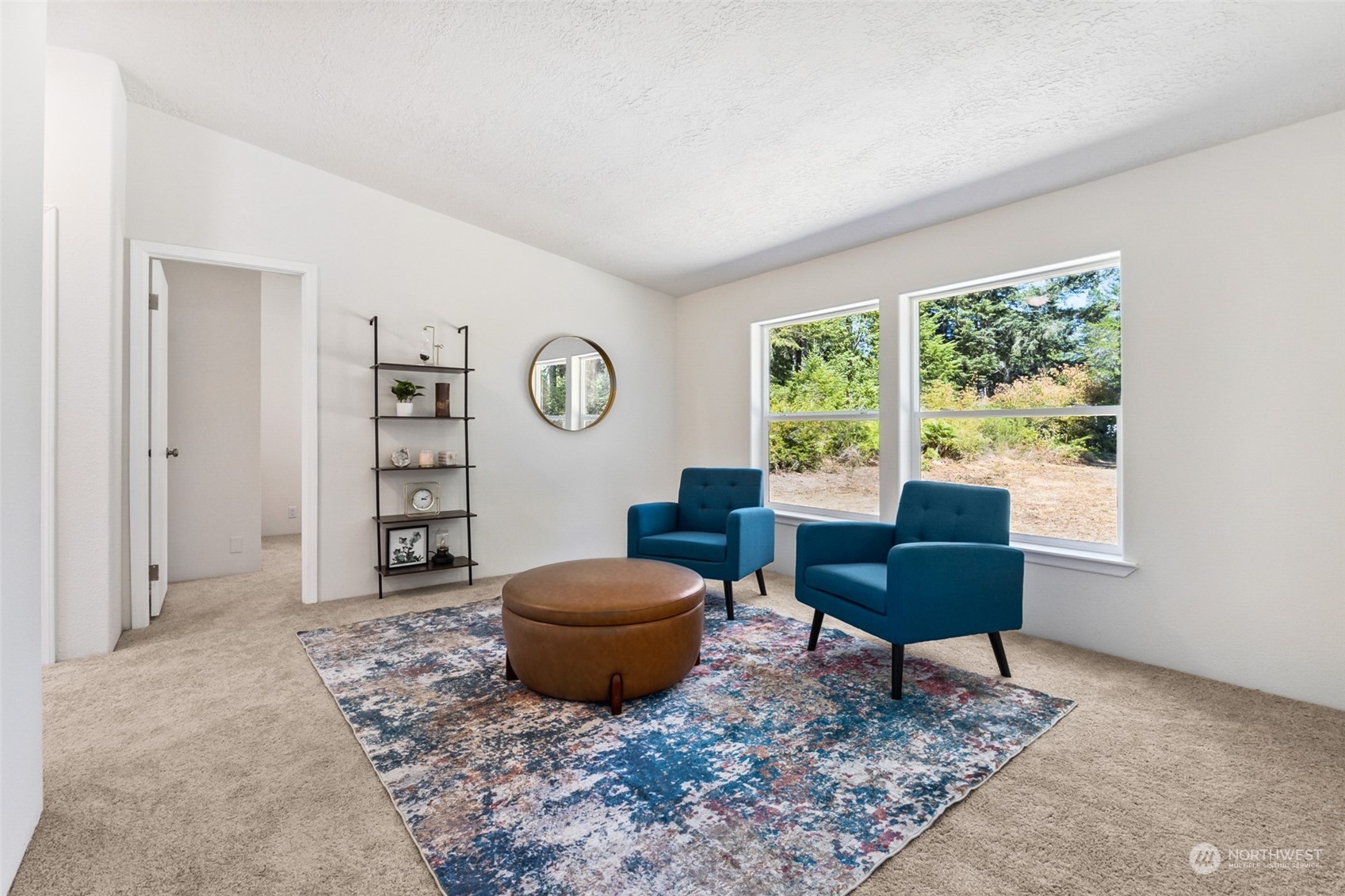 271 East Leffler Loop Road Grapeview, WA 98546 - Photo 15 of 36 a living room with furniture and a window
