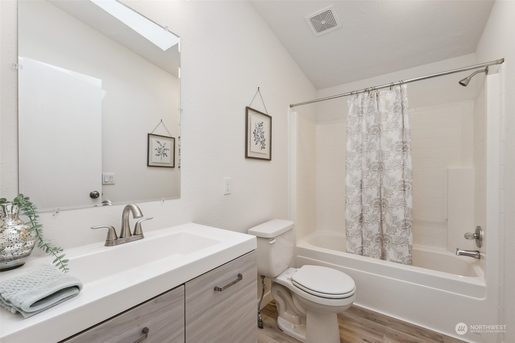 271 East Leffler Loop Road Grapeview, WA 98546 - Photo 17 of 36 a bathroom with a sink toilet a mirror and shower