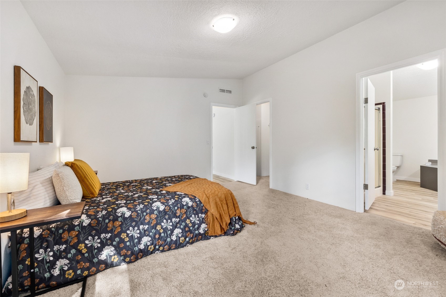 271 East Leffler Loop Road Grapeview, WA 98546 - Photo 21 of 36 a bedroom with a bed and a cabinets