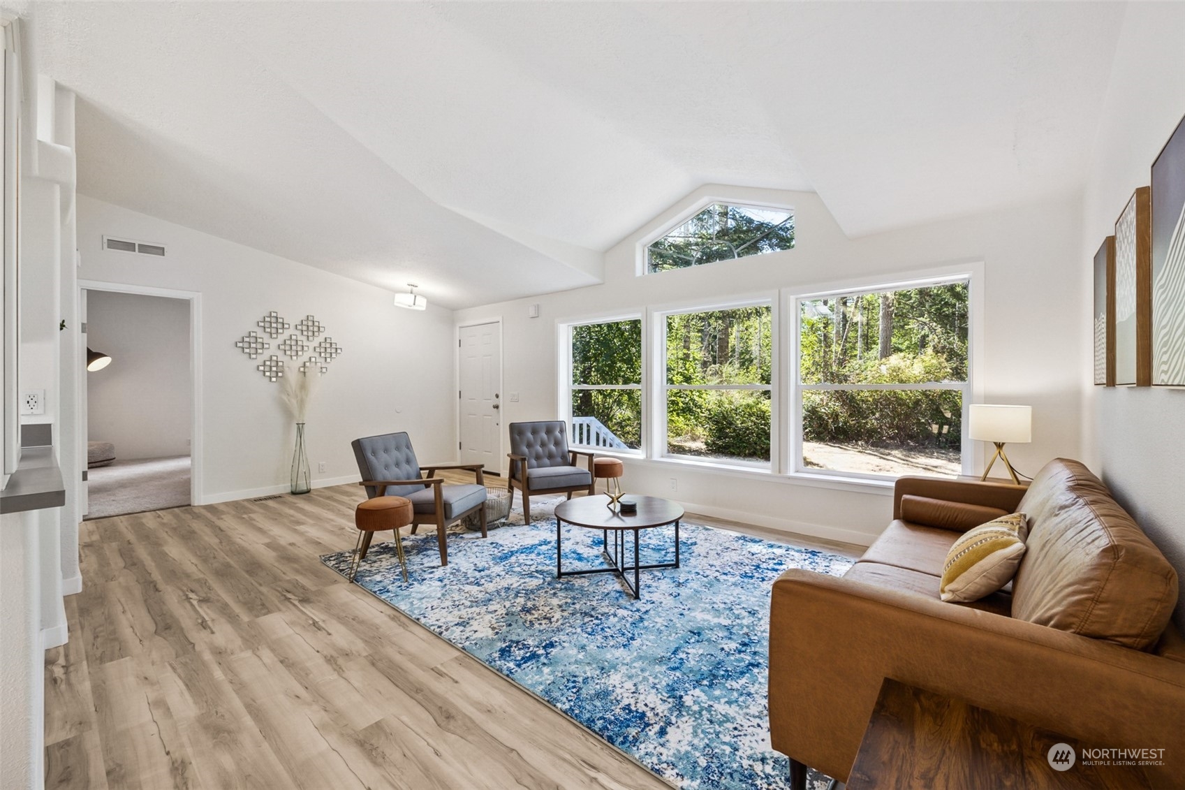 271 East Leffler Loop Road Grapeview, WA 98546 - Photo 5 of 36 a living room with furniture and a large window