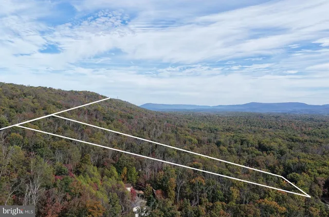 a view of outdoor space with deck and table