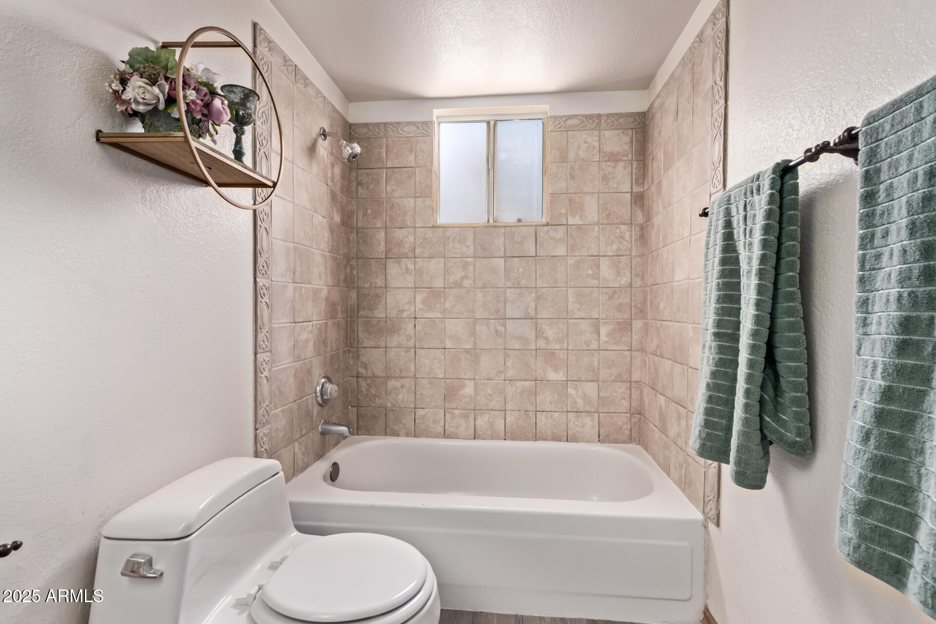 729 West Coolidge Street, Unit 211 Phoenix, AZ 85013 - Photo 17 of 21 a bathroom with a toilet bathtub and shower