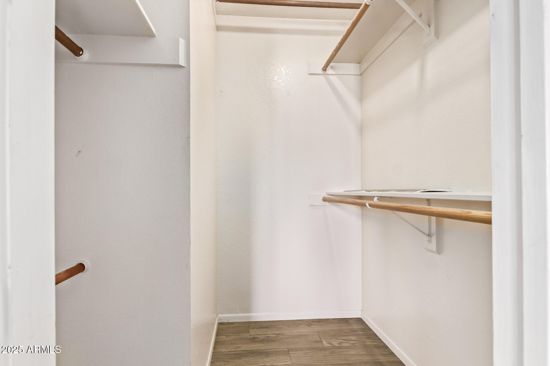 729 West Coolidge Street, Unit 211 Phoenix, AZ 85013 - Photo 18 of 21 a view of walk in closet with empty racks