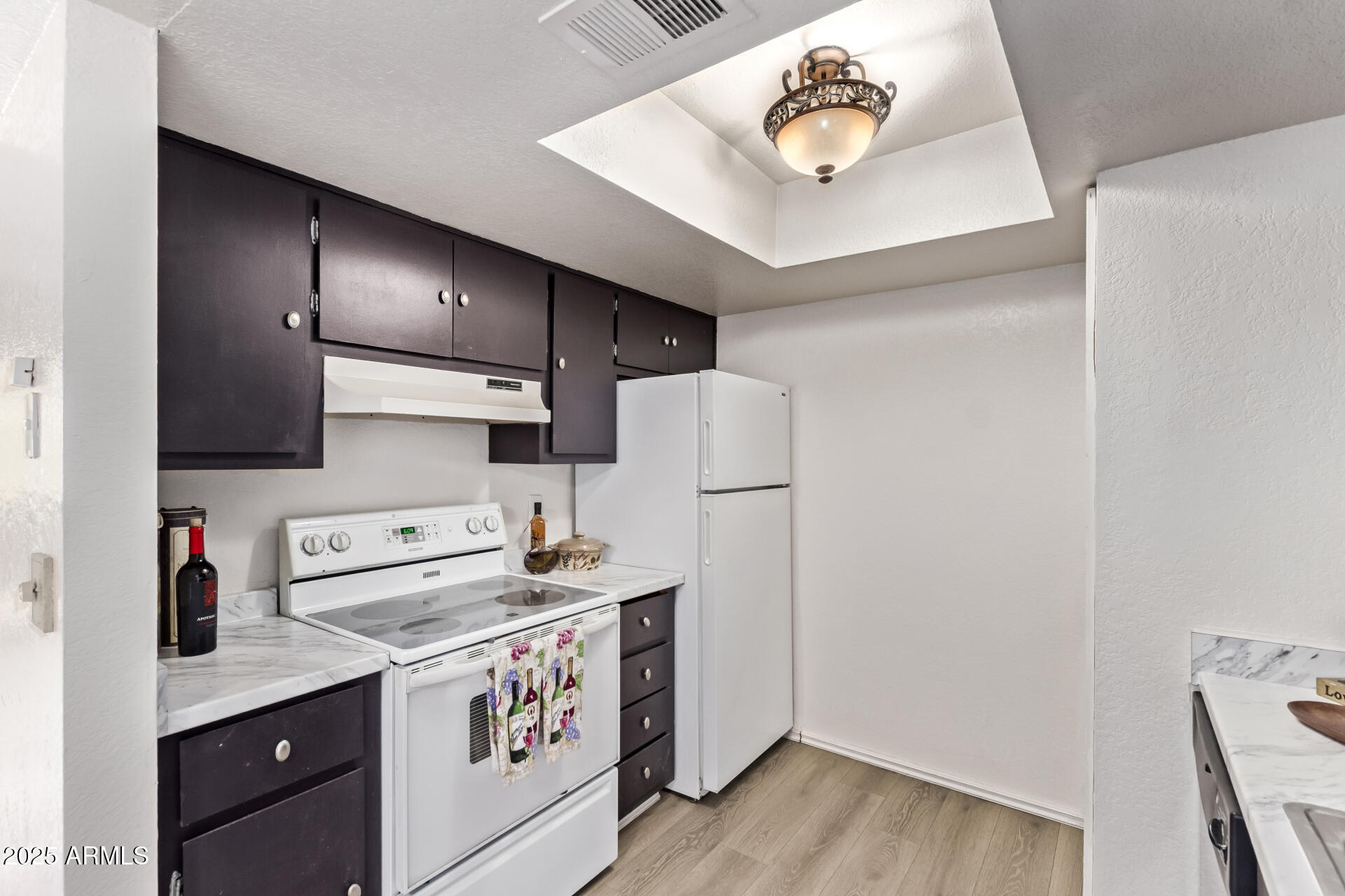 729 West Coolidge Street, Unit 211 Phoenix, AZ 85013 - Photo 9 of 21 a kitchen with a refrigerator and a sink