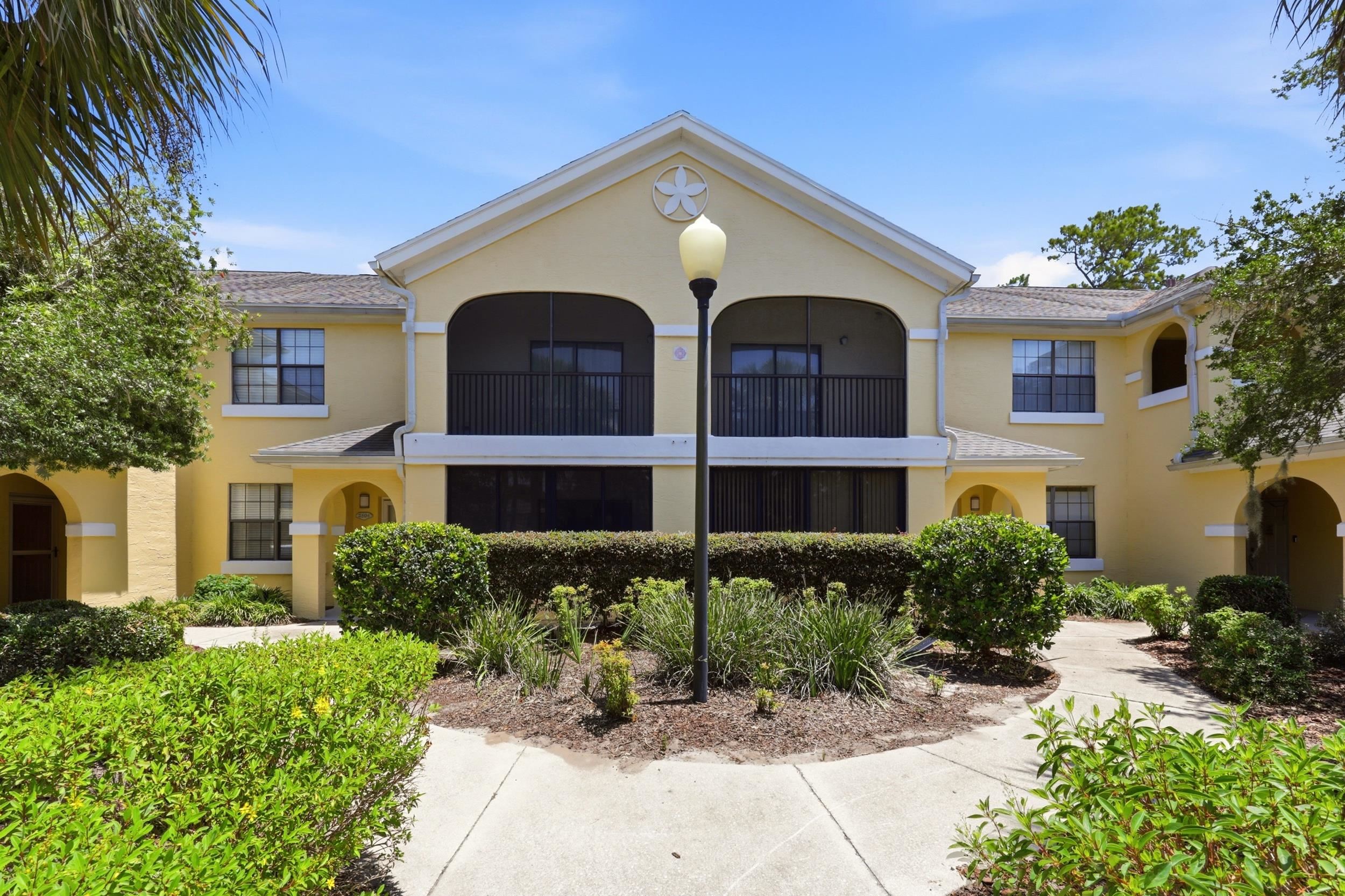 2500 Vista Cove Road St. Augustine, FL 32084 - Photo 2 of 53 a front view of a house with a yard