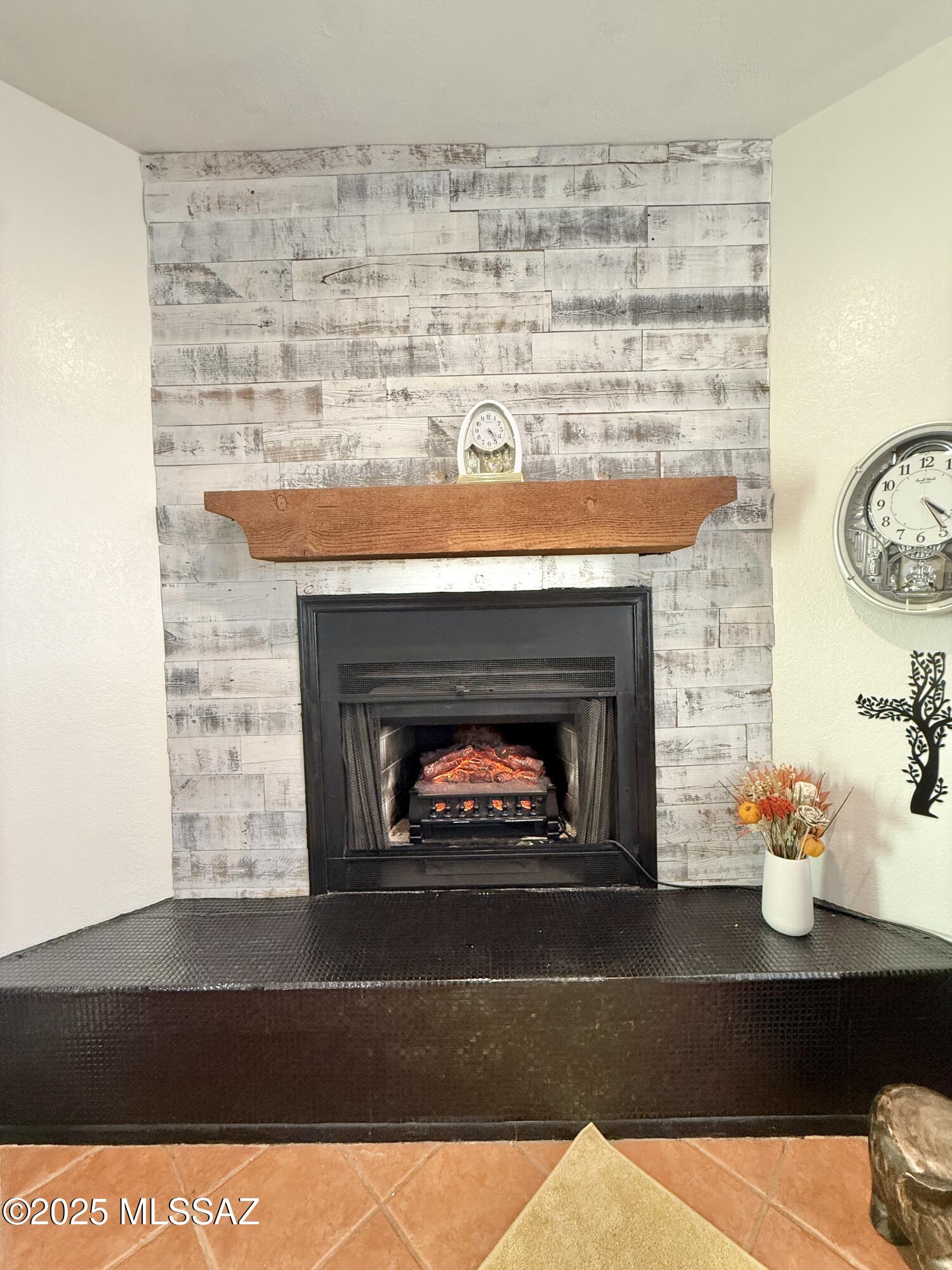 8110 East Rivenoak Circle Tucson, AZ 85715 - Photo 9 of 29 a living room with a fireplace and a fireplace