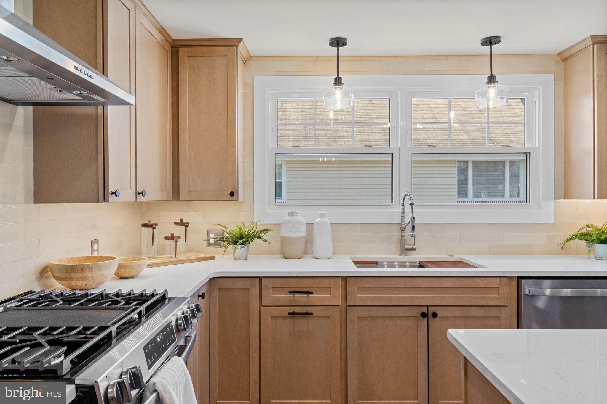 1439 Dorchester Road Havertown, PA 19083 - Photo 13 of 60 a kitchen with stainless steel appliances a sink stove and cabinets
