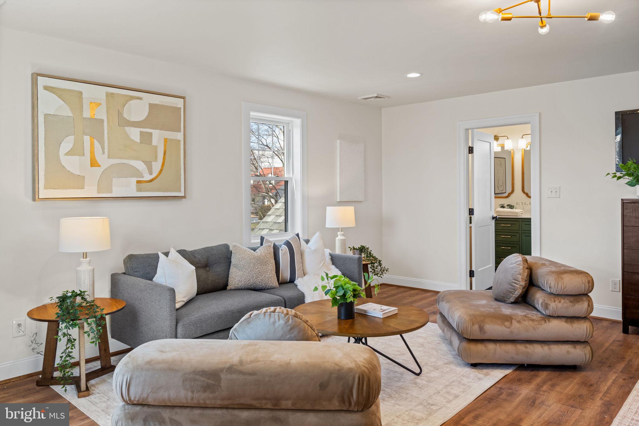 1439 Dorchester Road Havertown, PA 19083 - Photo 29 of 60 a living room with furniture and painting on the wall