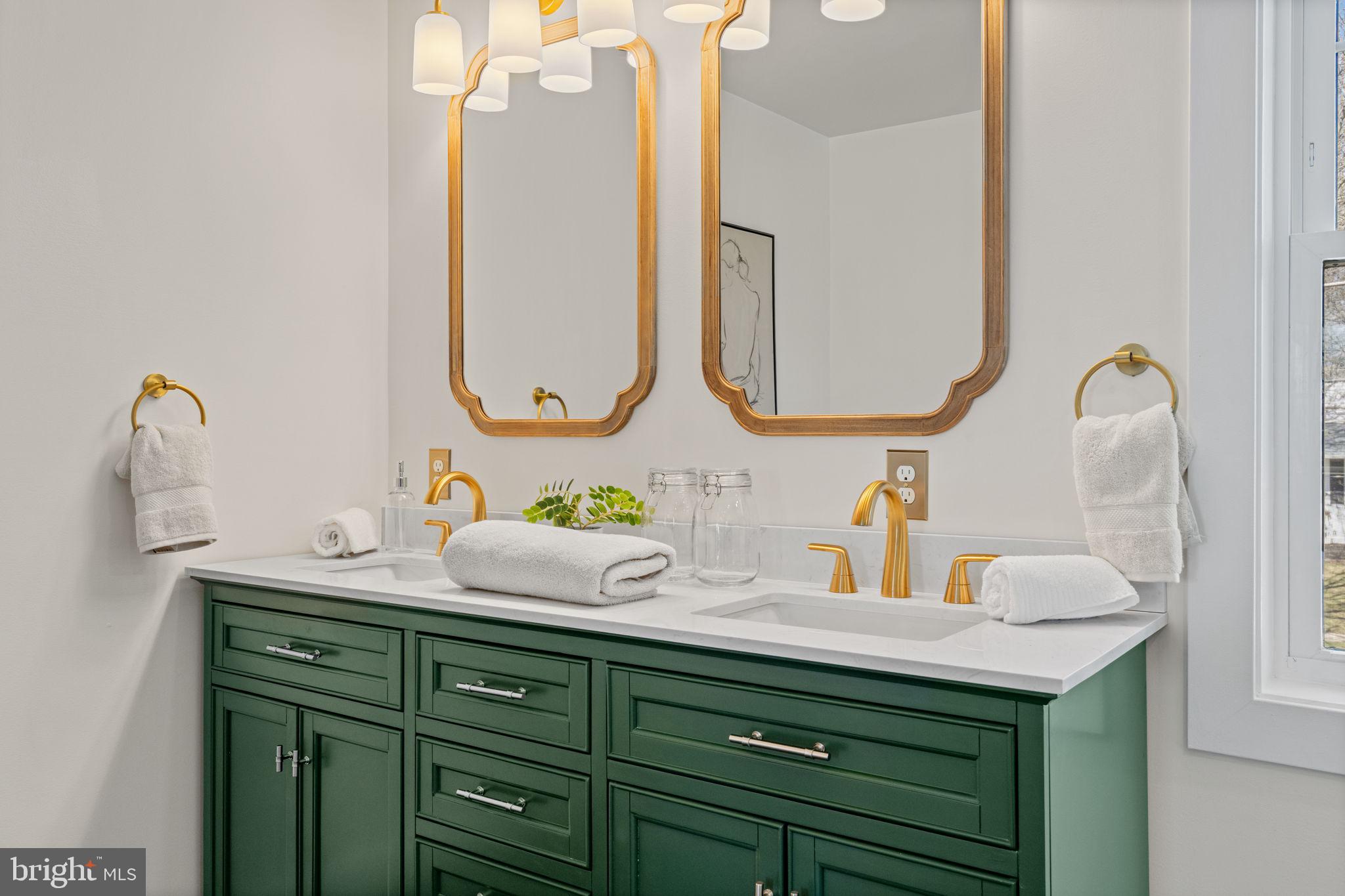 1439 Dorchester Road Havertown, PA 19083 - Photo 31 of 60 a bathroom with a sink and a mirror