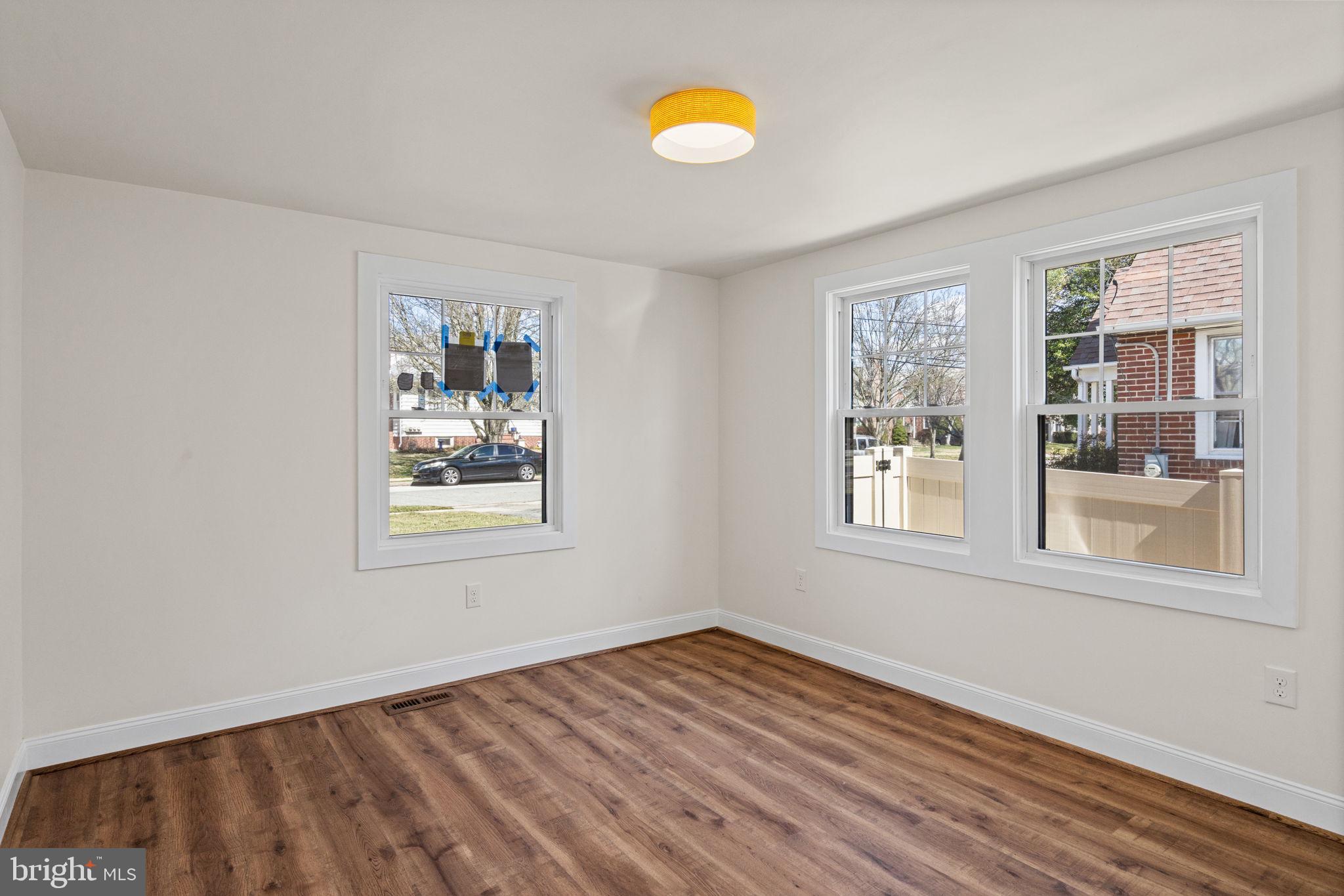 1439 Dorchester Road Havertown, PA 19083 - Photo 38 of 60 a view of empty room with wooden floor and window