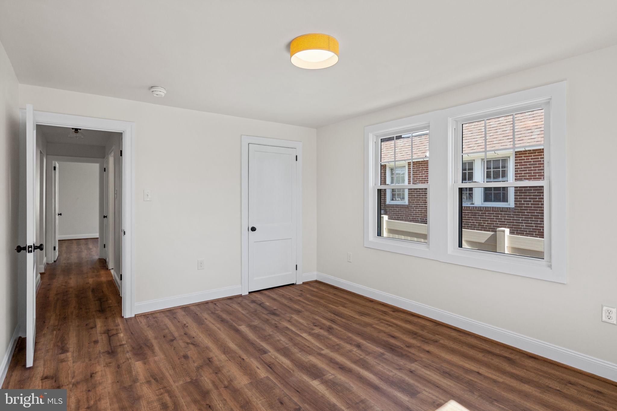 1439 Dorchester Road Havertown, PA 19083 - Photo 41 of 60 a view of empty room with wooden floor and fan