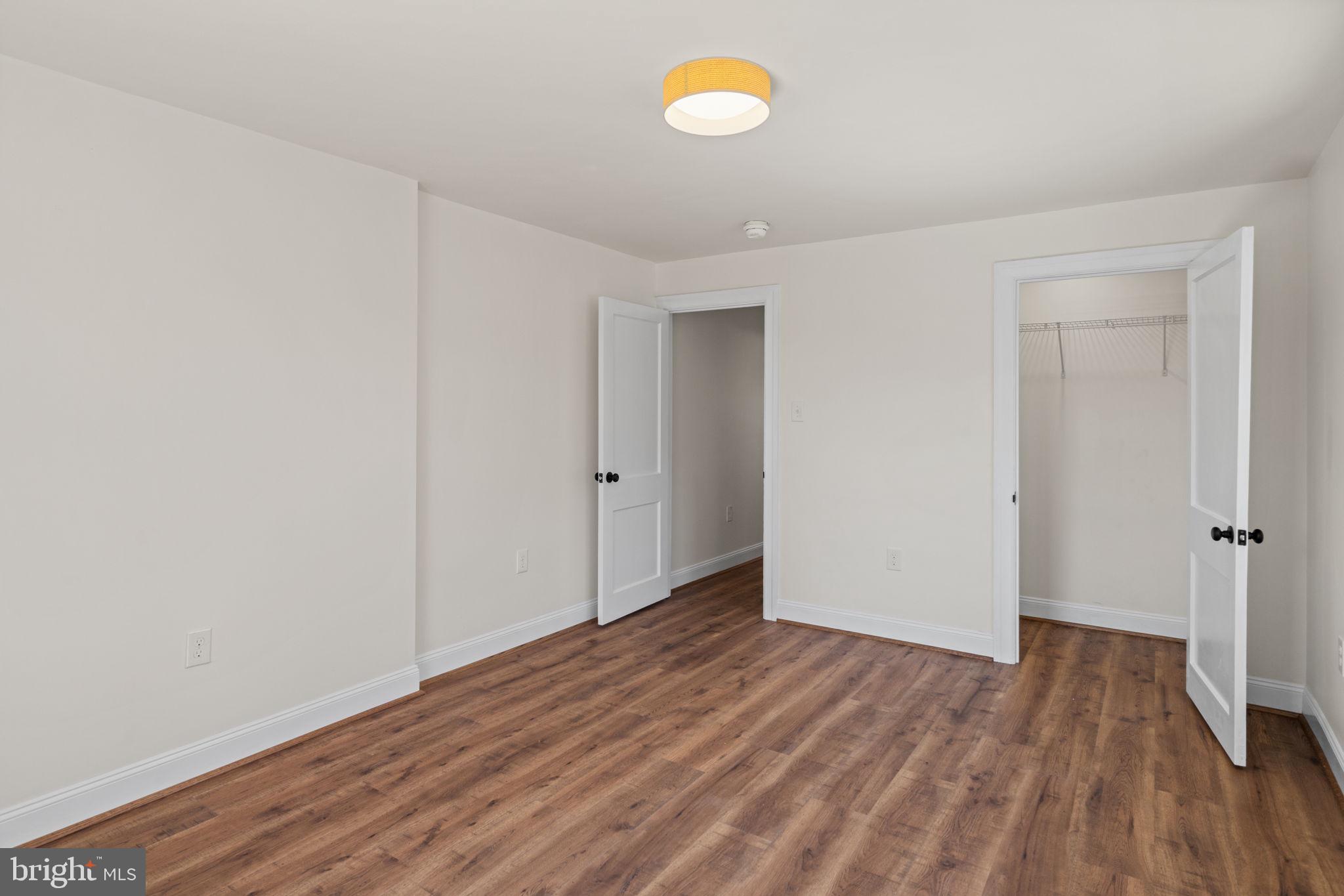 1439 Dorchester Road Havertown, PA 19083 - Photo 42 of 60 a view of an empty room with wooden floor