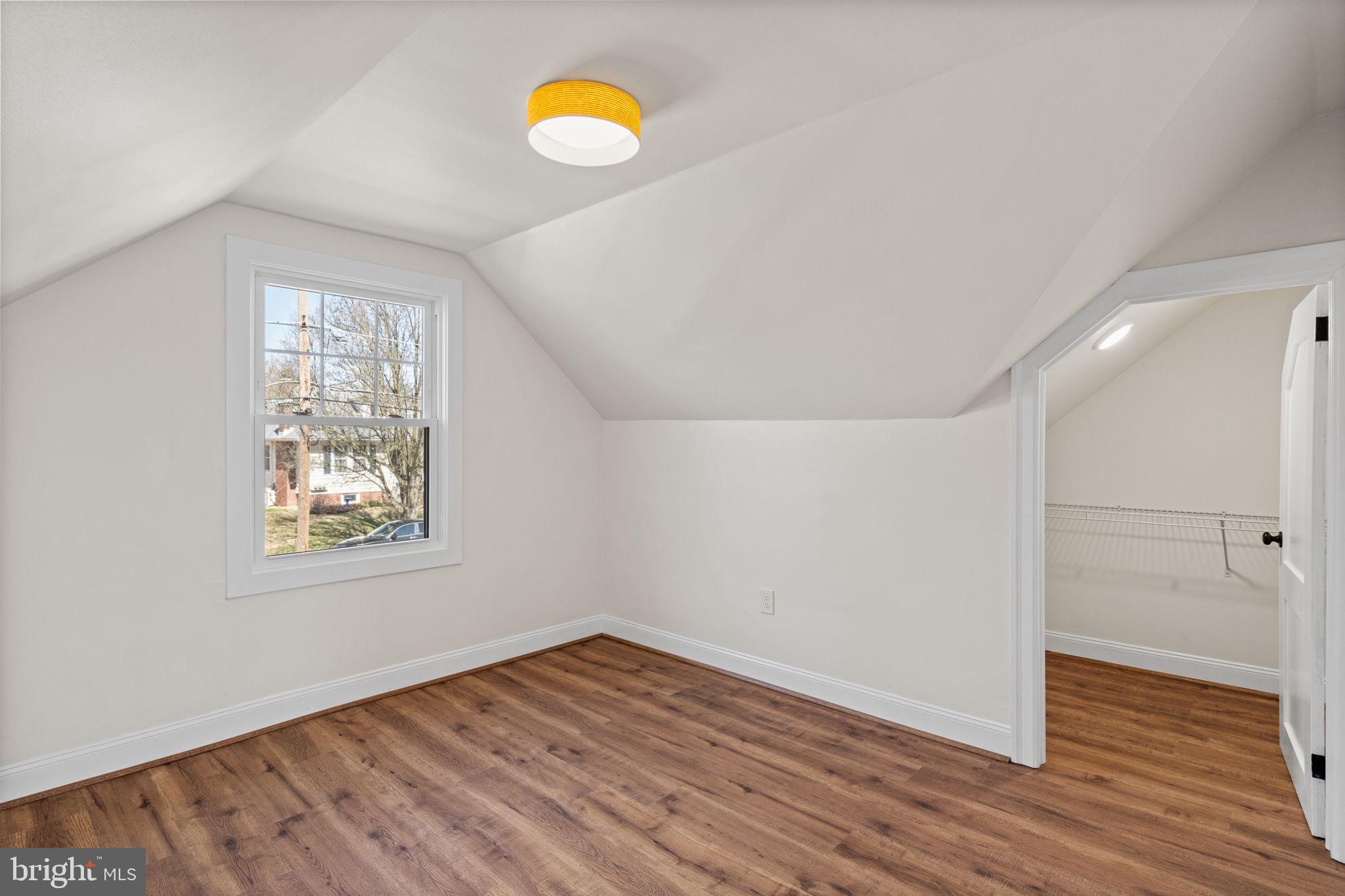 1439 Dorchester Road Havertown, PA 19083 - Photo 45 of 60 an empty room with wooden floor and windows