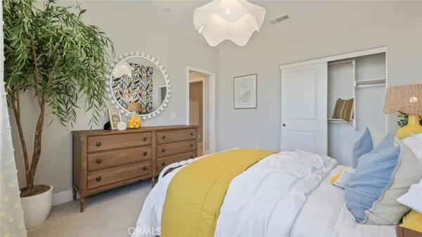 a spacious bathroom with a double vanity sink a mirror and shower