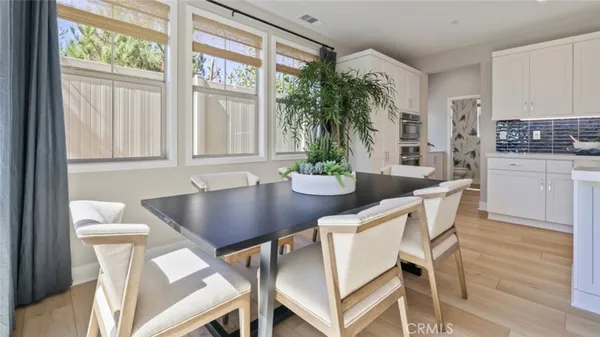 a view of a dining room with furniture and window