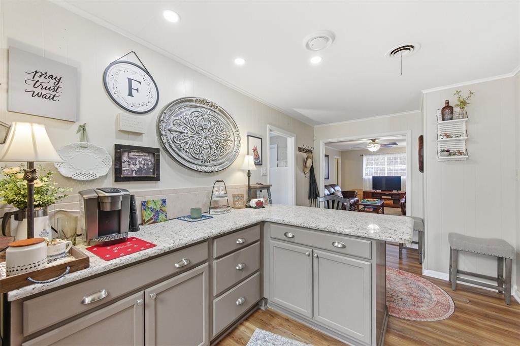 515 Pecan Street Collinsville, TX 76233 - Photo 14 of 39 a very nice looking room with a large mirror