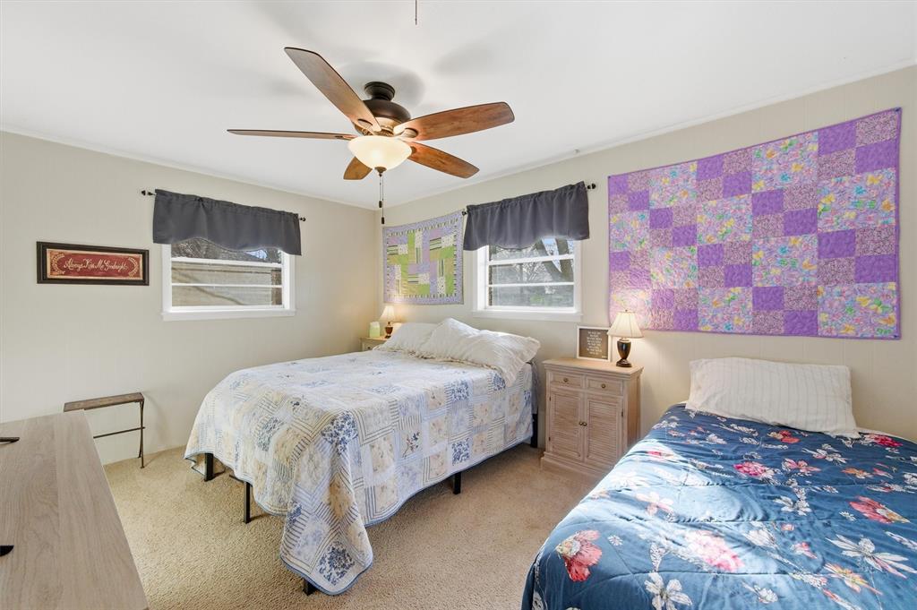 515 Pecan Street Collinsville, TX 76233 - Photo 16 of 39 a bedroom with double bed and a window