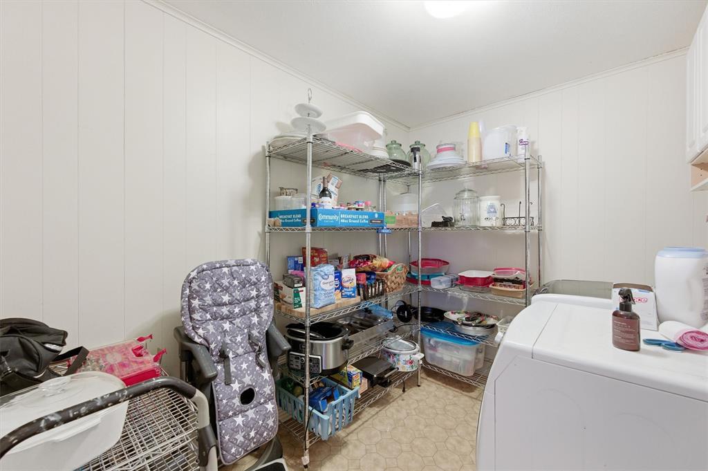 515 Pecan Street Collinsville, TX 76233 - Photo 29 of 39 a room with storage and utility