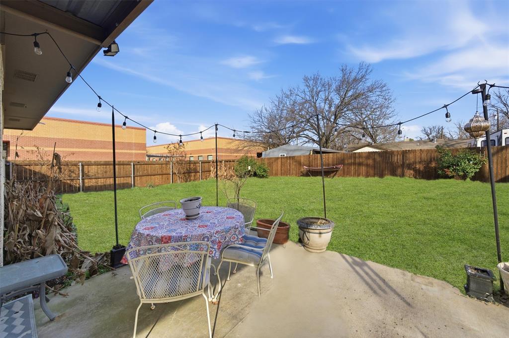 515 Pecan Street Collinsville, TX 76233 - Photo 34 of 39 a view of a backyard with sitting area