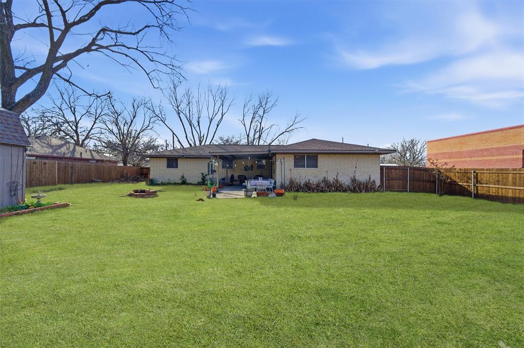 515 Pecan Street Collinsville, TX 76233 - Photo 35 of 39 a front view of a house with garden