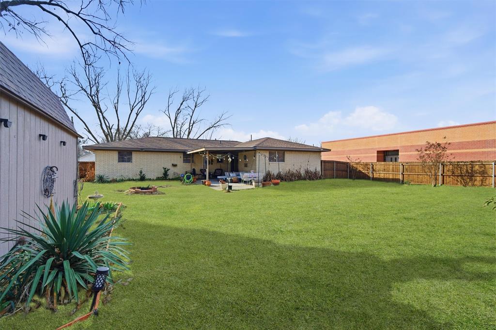 515 Pecan Street Collinsville, TX 76233 - Photo 36 of 39 a front view of a house with garden