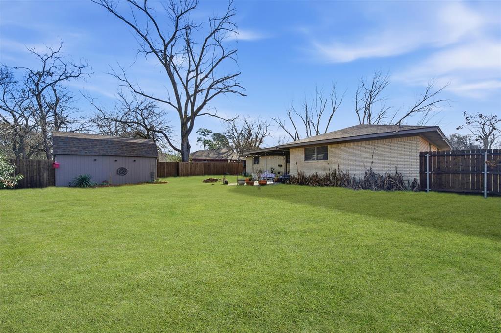 515 Pecan Street Collinsville, TX 76233 - Photo 37 of 39 a front view of house with yard and green space