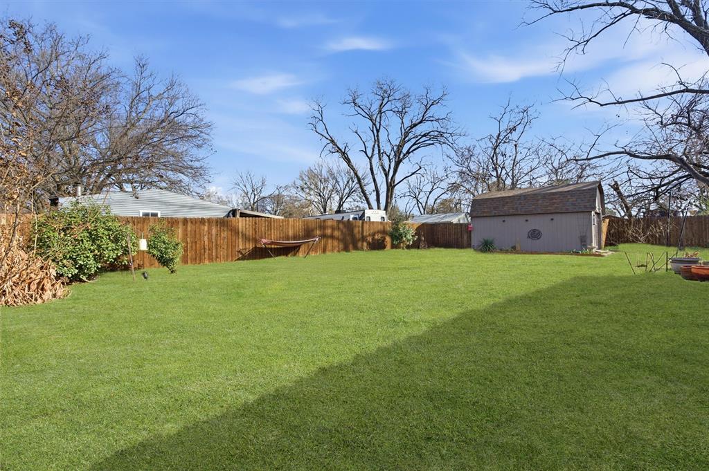 515 Pecan Street Collinsville, TX 76233 - Photo 39 of 39 a view of a house with a big yard