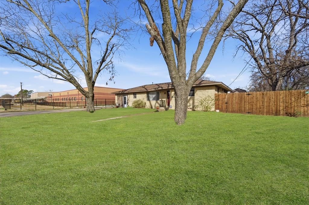515 Pecan Street Collinsville, TX 76233 - Photo 4 of 39 a view of a house with backyard
