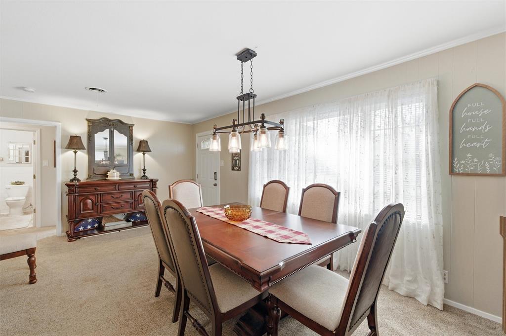 515 Pecan Street Collinsville, TX 76233 - Photo 9 of 39 a dining room with furniture and window