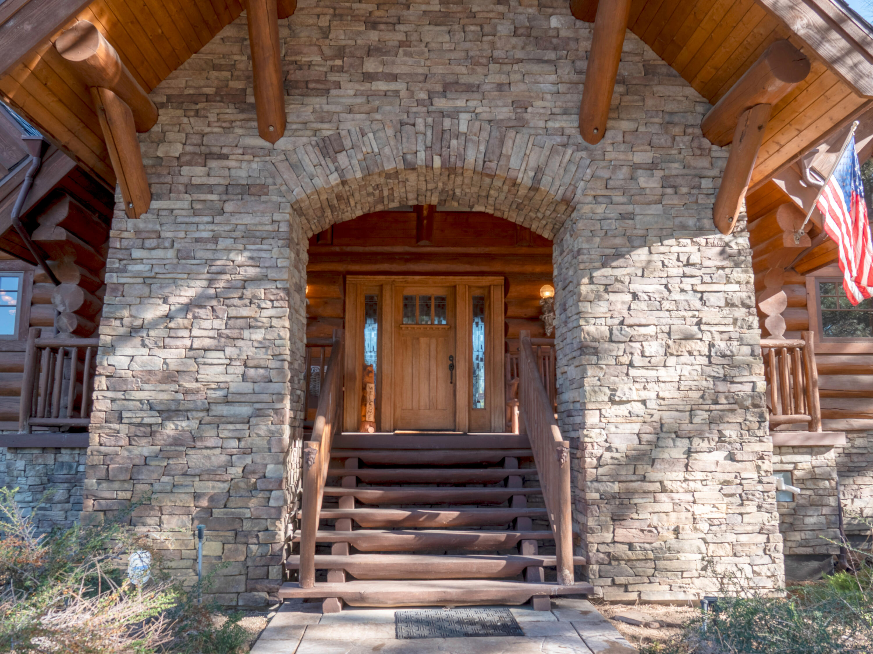 61072 Devils Ladder Road Mountain Center, CA 92561 - Photo 2 of 81 a front view of a building with glass windows
