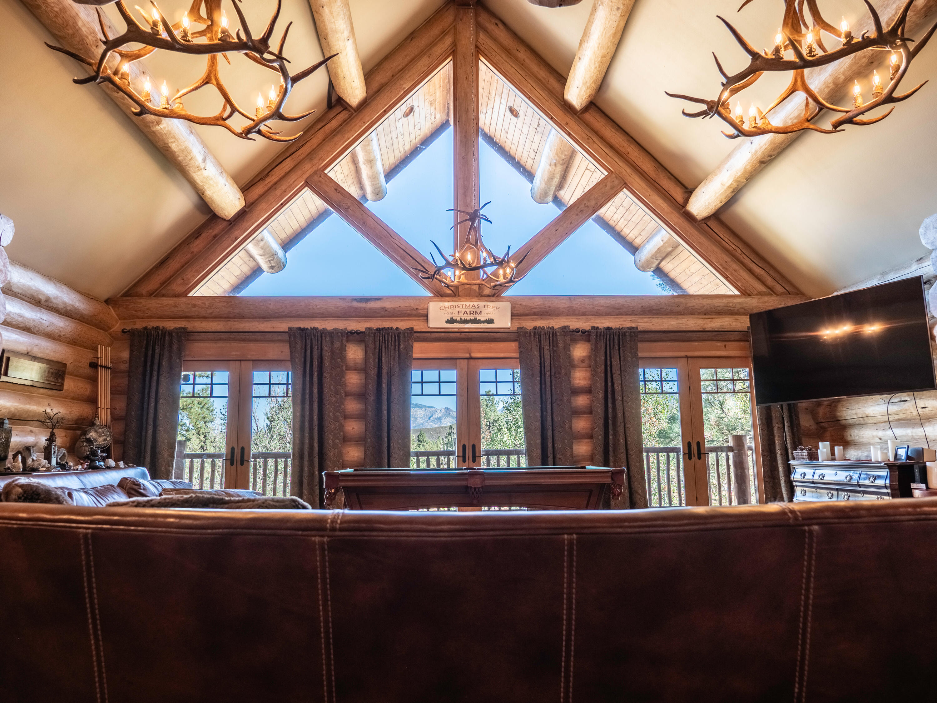 61072 Devils Ladder Road Mountain Center, CA 92561 - Photo 25 of 81 a living room with furniture and a large window
