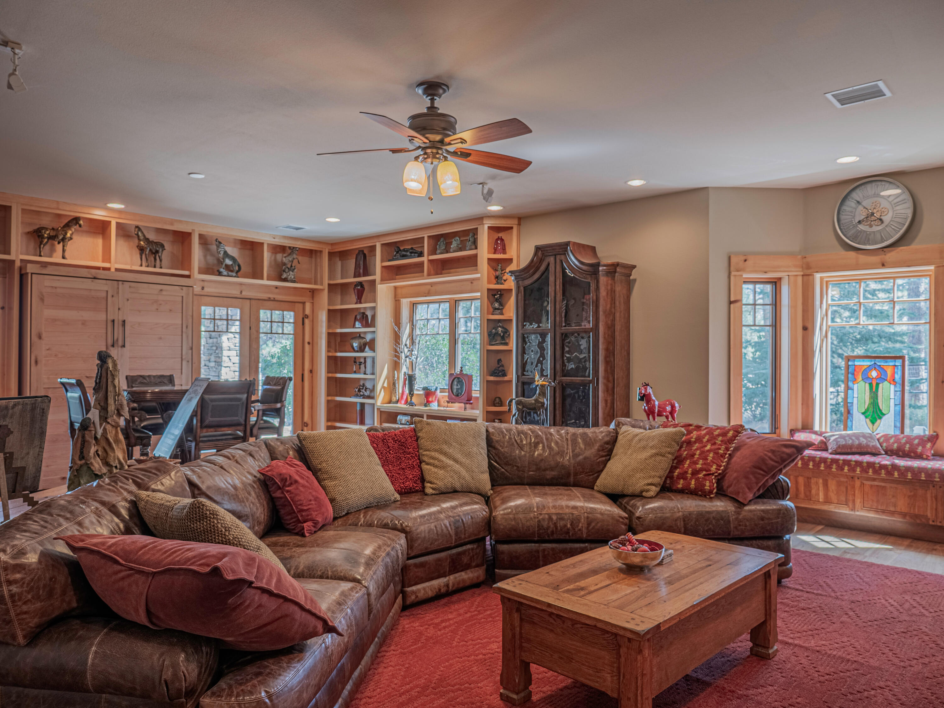 61072 Devils Ladder Road Mountain Center, CA 92561 - Photo 49 of 81 a living room with furniture ceiling fan and a large window