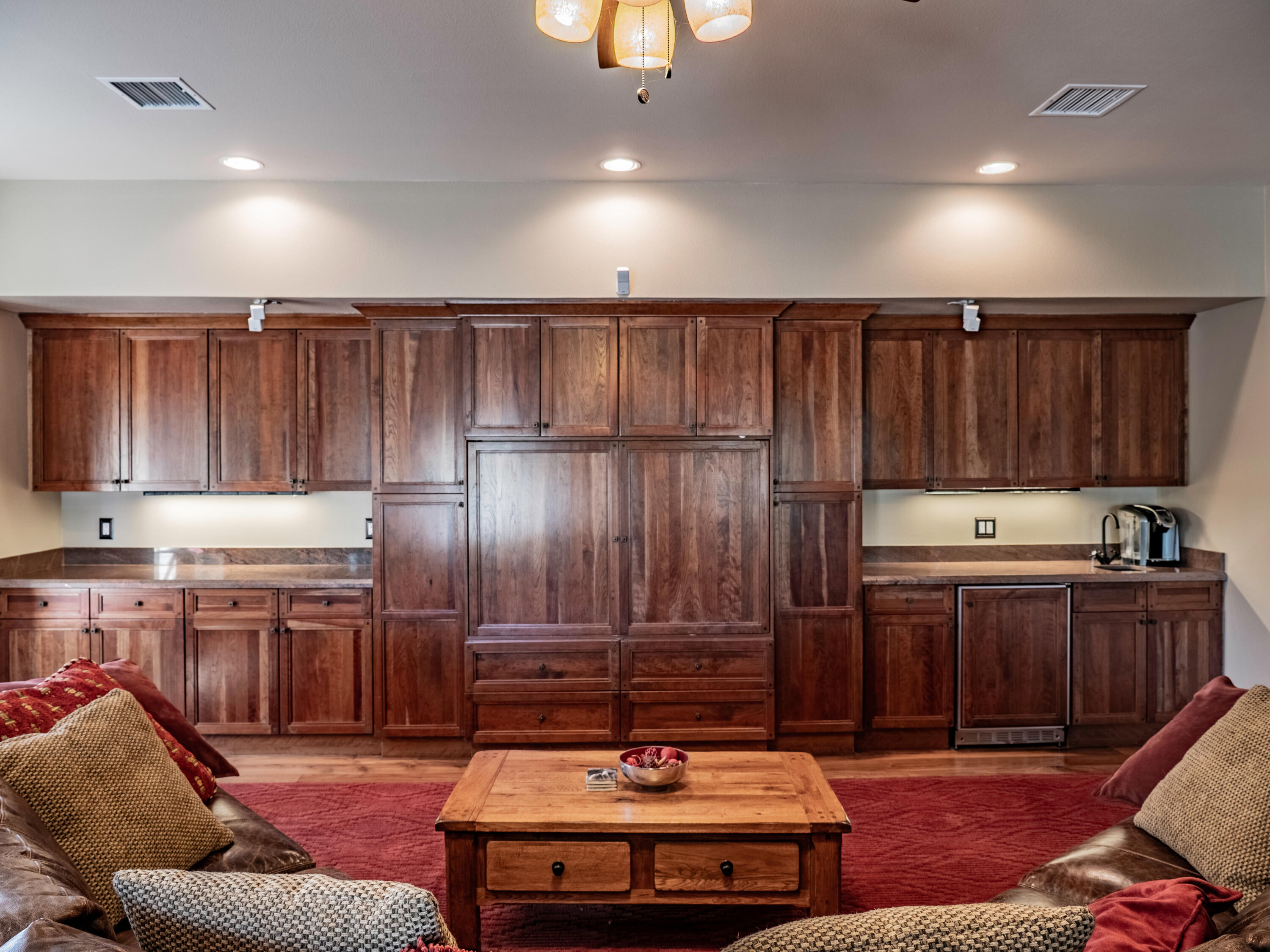 61072 Devils Ladder Road Mountain Center, CA 92561 - Photo 52 of 81 a kitchen with granite countertop a stove a sink dishwasher and a refrigerator with wooden cabinets
