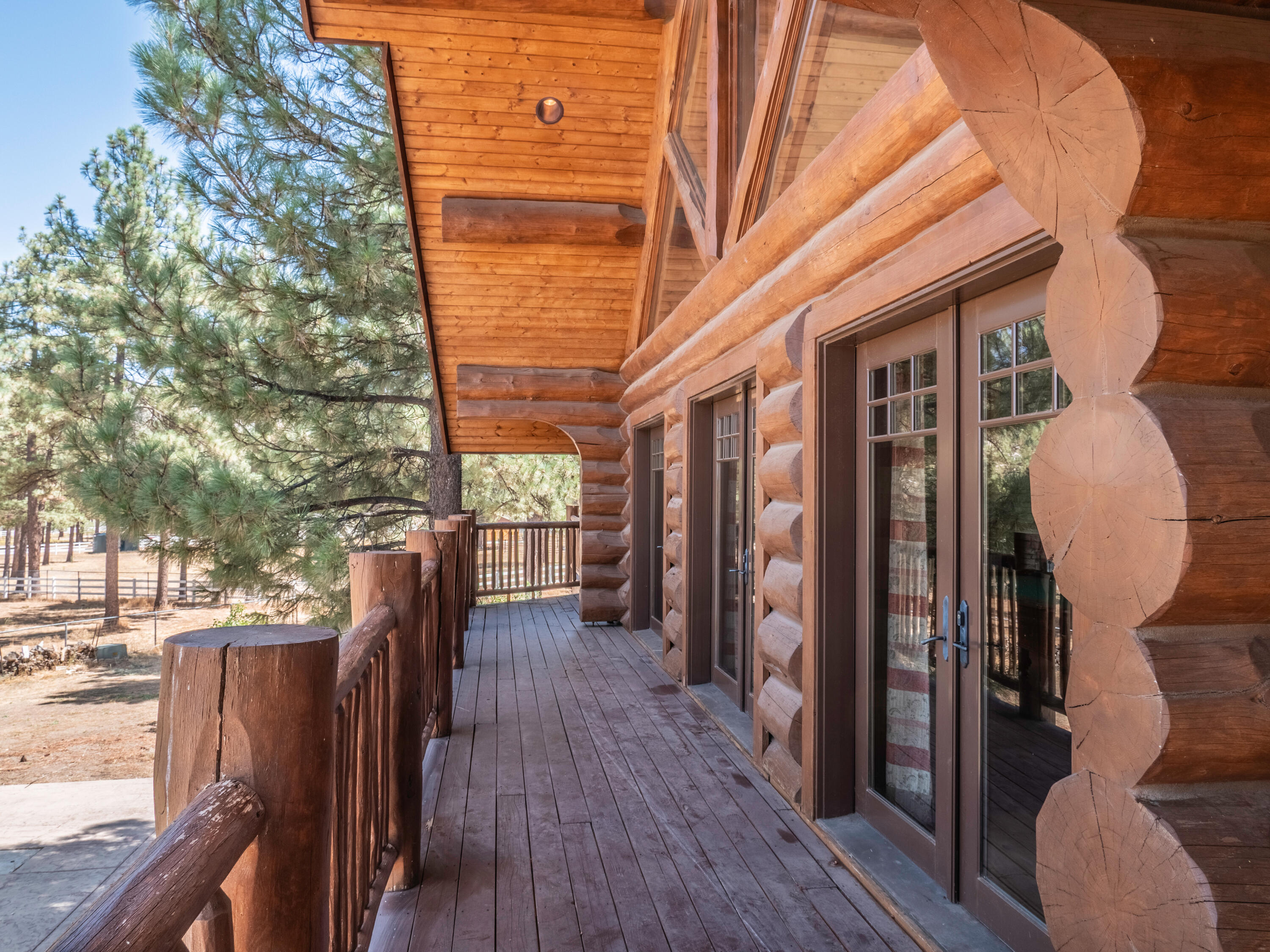 61072 Devils Ladder Road Mountain Center, CA 92561 - Photo 61 of 81 a view of a patio with wooden floor and iron fence
