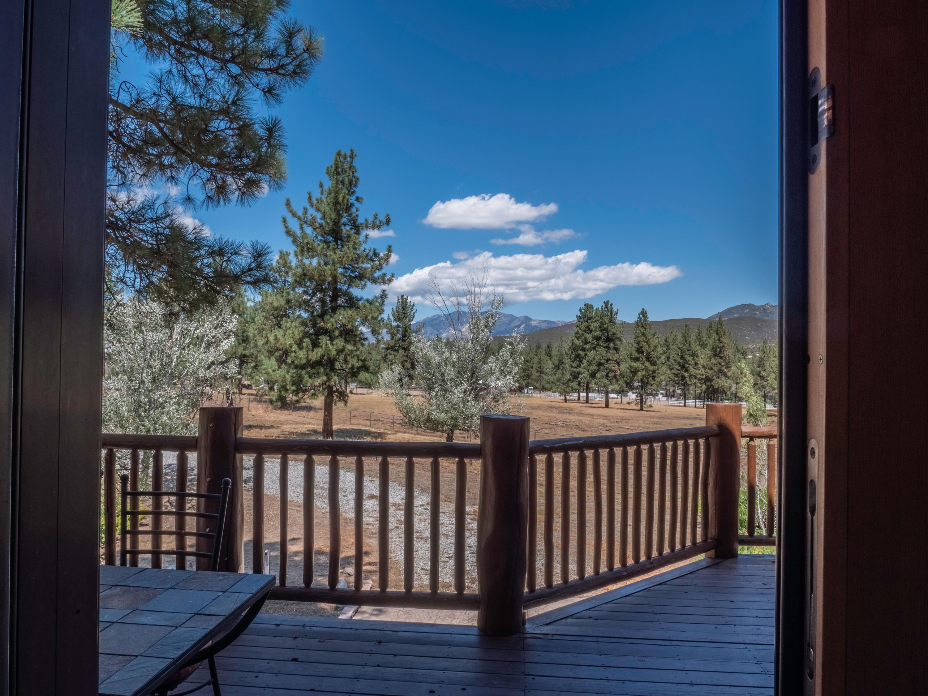 61072 Devils Ladder Road Mountain Center, CA 92561 - Photo 65 of 81 a view of a balcony with wooden floor and fence