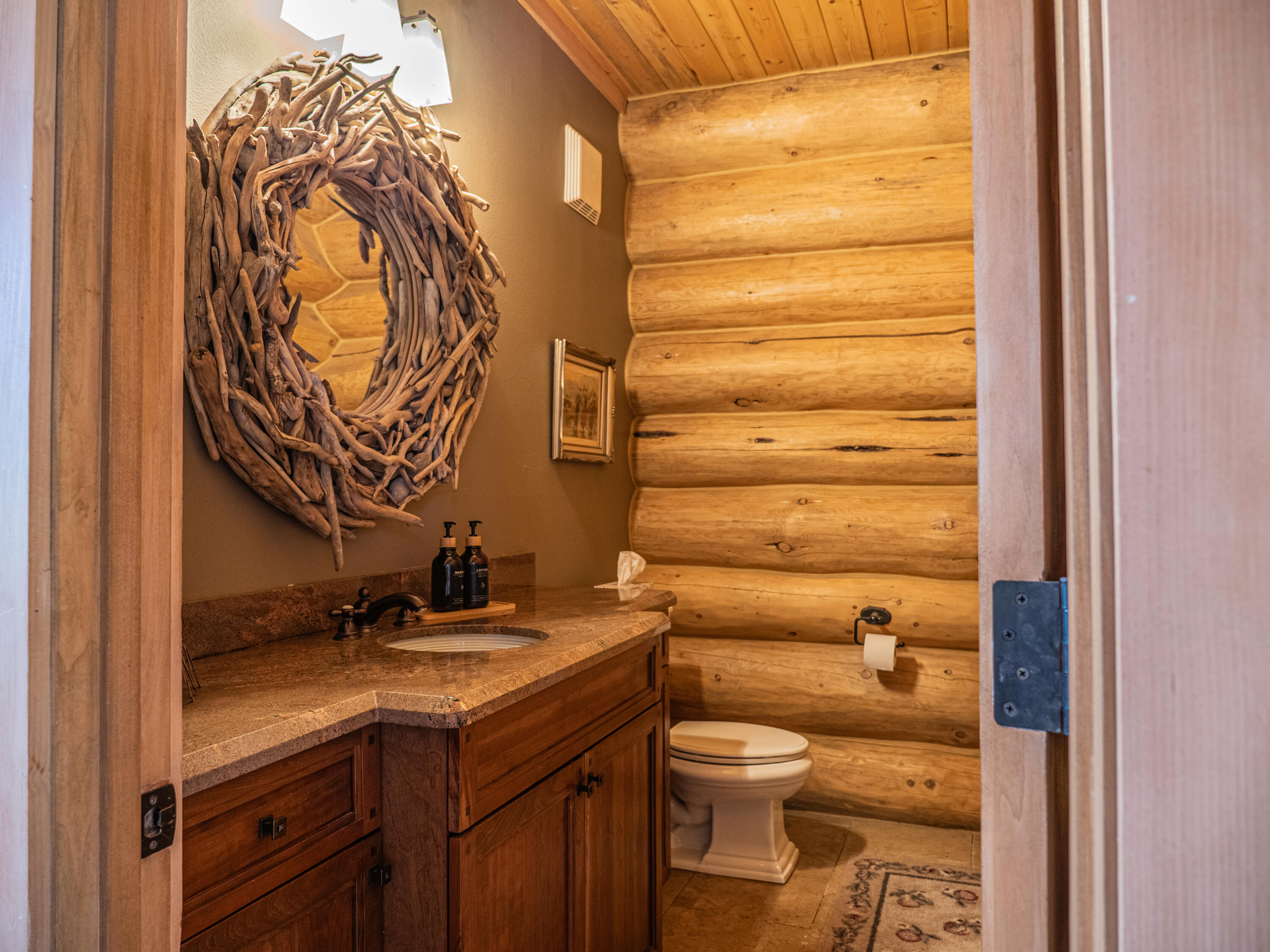 61072 Devils Ladder Road Mountain Center, CA 92561 - Photo 7 of 81 a bathroom with a granite countertop sink and a toilet