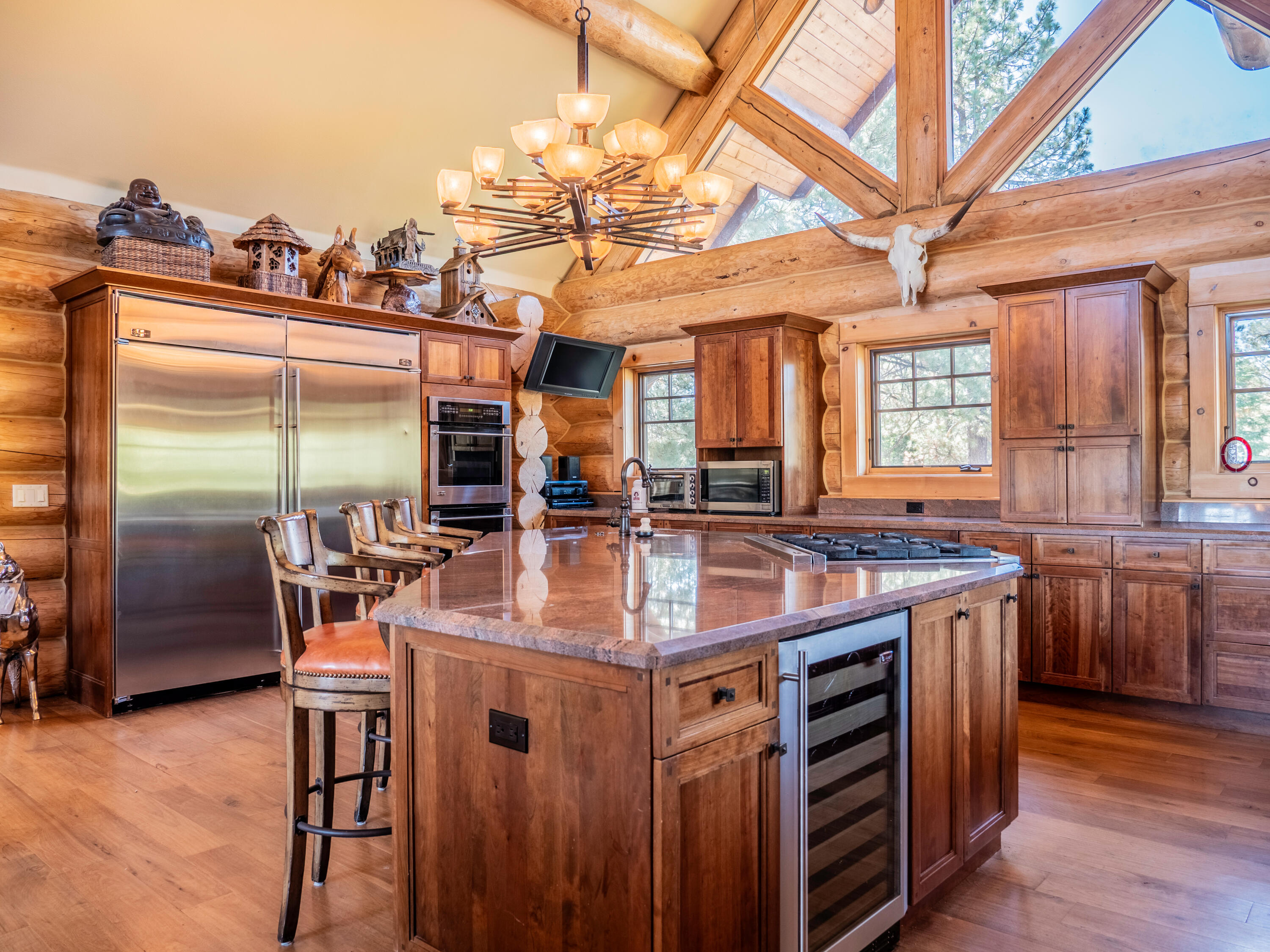 61072 Devils Ladder Road Mountain Center, CA 92561 - Photo 9 of 81 a kitchen with stainless steel appliances granite countertop a stove and a refrigerator