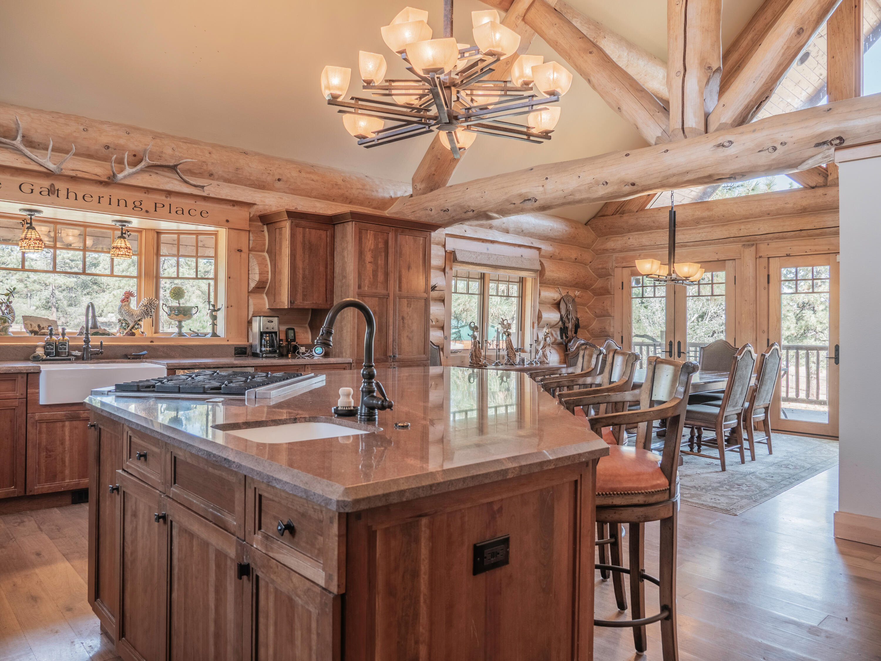 61072 Devils Ladder Road Mountain Center, CA 92561 - Photo 10 of 81 a kitchen with lots of counter top space and dining table