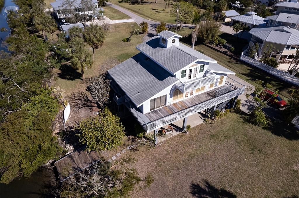 145 Burns Road Terra Ceia, FL 34250 - Photo 32 of 65 an aerial view of a house with a yard
