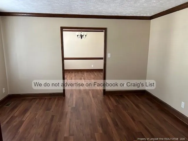 a view of a hardwood floor in a room